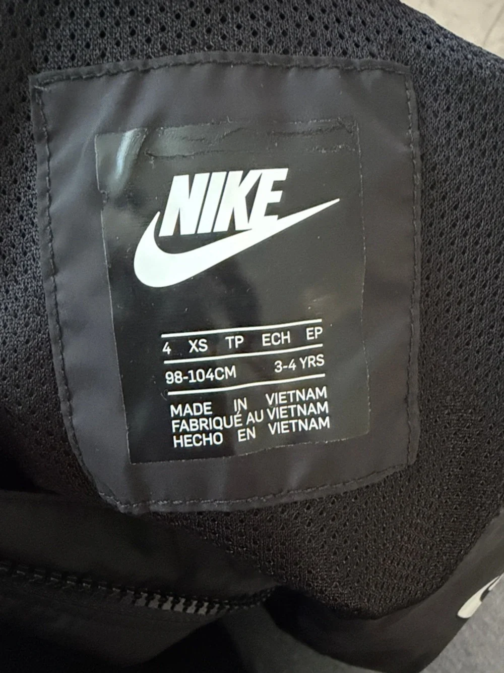 Nike Black Jacket with White Swoosh and Sleeve Text - Picture 2 of 3